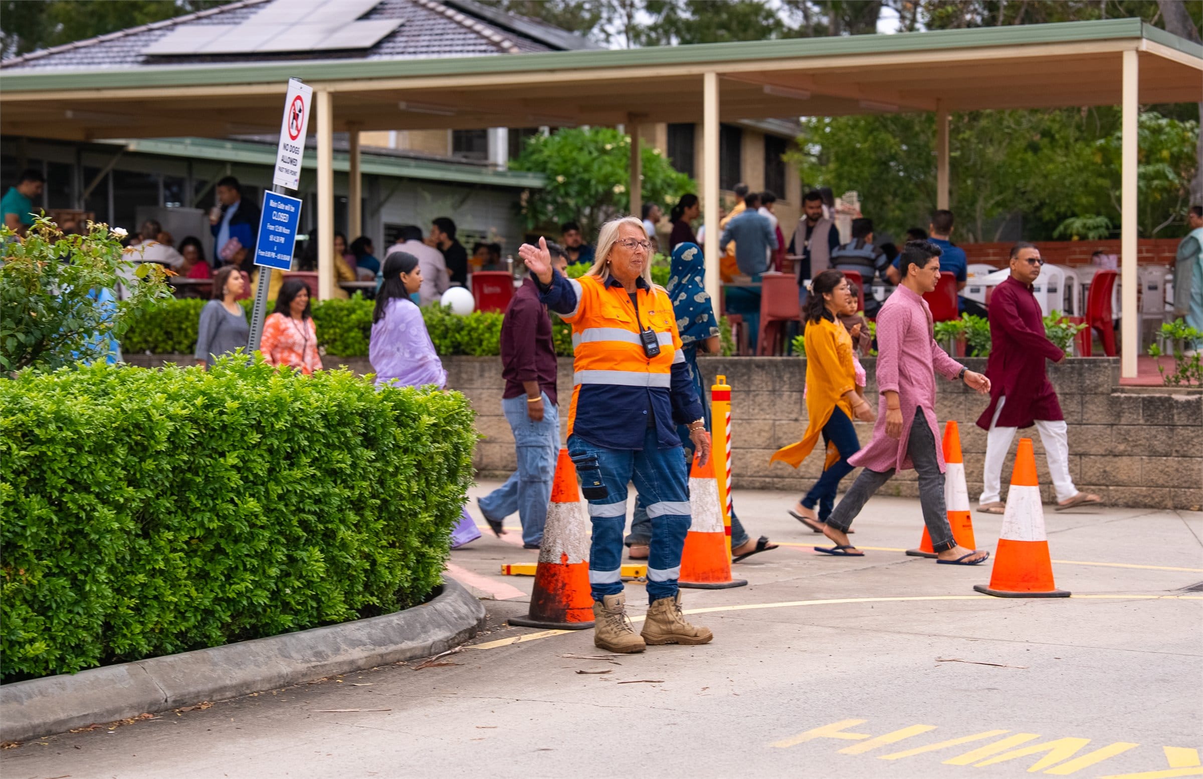 Roadlink Group traffic controller managing pedestrian movement at a NSW event